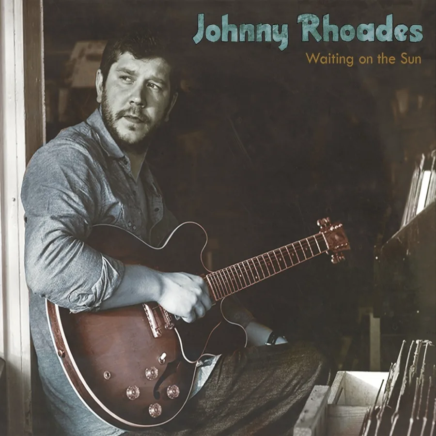Waiting on the Sun album cover: Johnny seated by a window with a hollow-body guitar